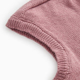 Details of the rose‑brown striped sweater: ribbed and solid color knit.