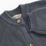 Dark blue knit suit with rib collar, button closure, and marble brand.