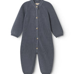 Dark blue knitted jumpsuit for baby with front buttons and long sleeves and legs.