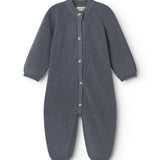 Dark blue knitted jumpsuit for baby with front buttons and long sleeves and legs.