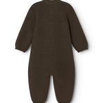 Dark knit jumpsuit with long sleeves and legs, seen from behind.