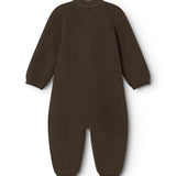 Dark knit jumpsuit with long sleeves and legs, seen from behind.