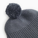 Gray knit hat with pompom and ribbed knit edges