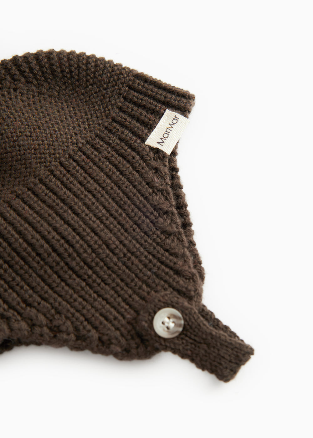 Dark brown ribbed hat with ribbing, snap closure, and label.