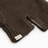 Dark brown striped cap in rib knit with a label at the edge and a hole for the face.