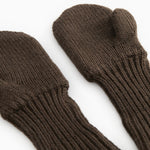 Dark brown knitted gloves with ribbed edge and thumb hole.