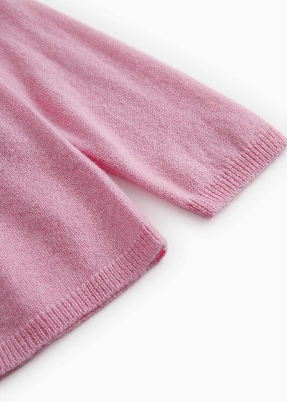 Pink knitted cashmere cardigan with ribbed cuffs and hem.