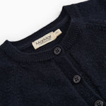 Dark indigo baby cardigan with ribbed edge, button closure, and branded neckline.