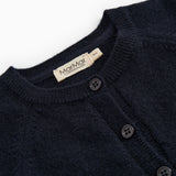 Dark indigo baby cardigan with ribbed edge, button closure, and branded neckline.