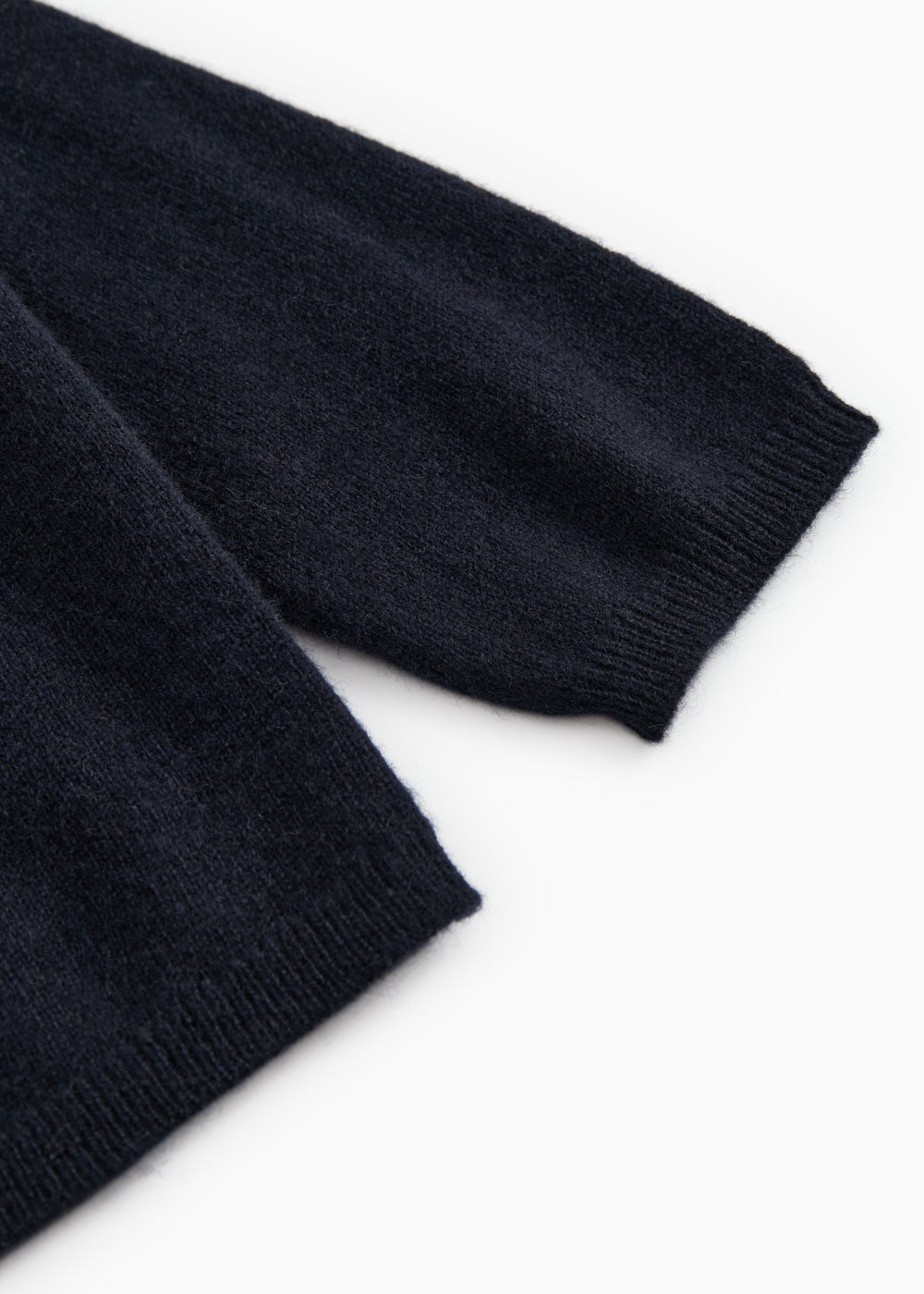 Dark indigo baby cardigan with ribbed cuffs and hem.