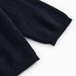 Dark indigo baby cardigan with ribbed cuffs and hem.