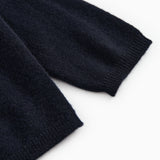 Dark indigo baby cardigan with ribbed cuffs and hem.
