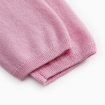 Pink Kashmir pants with ribbed hem at the leg ends.