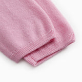 Pink Kashmir pants with ribbed hem at the leg ends.