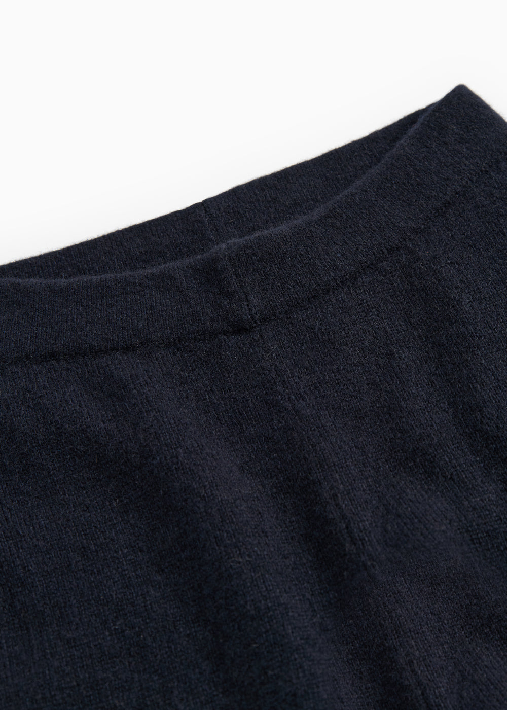 Powy Kashmir pants and indigo: close-up of ribbing and fabric texture.
