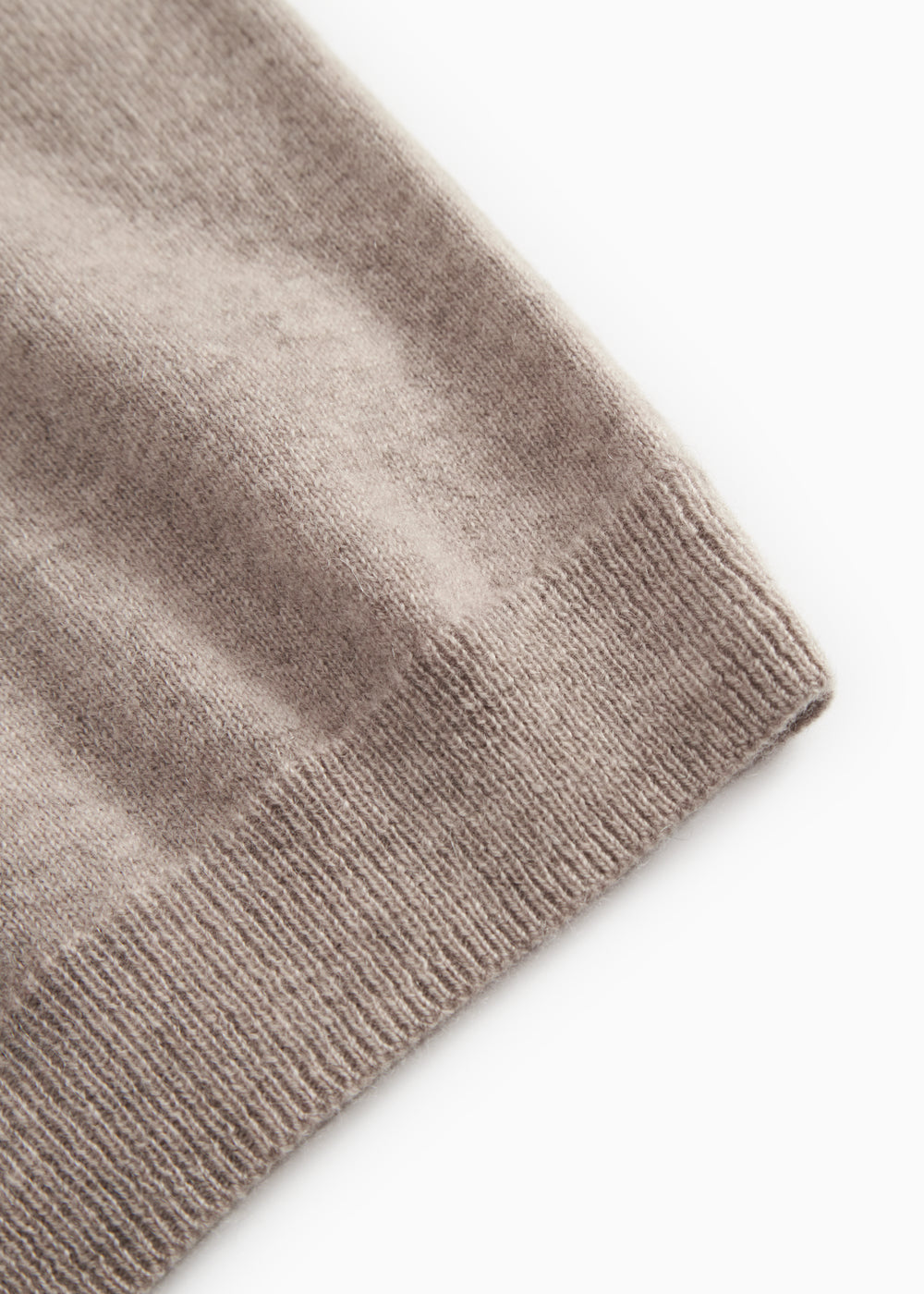 Gray textured knit sweater with ribbed cuffs.