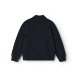 Long-sleeve polo shirt in dark indigo seen from behind with collar