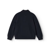 Long-sleeve polo shirt in dark indigo seen from behind with collar