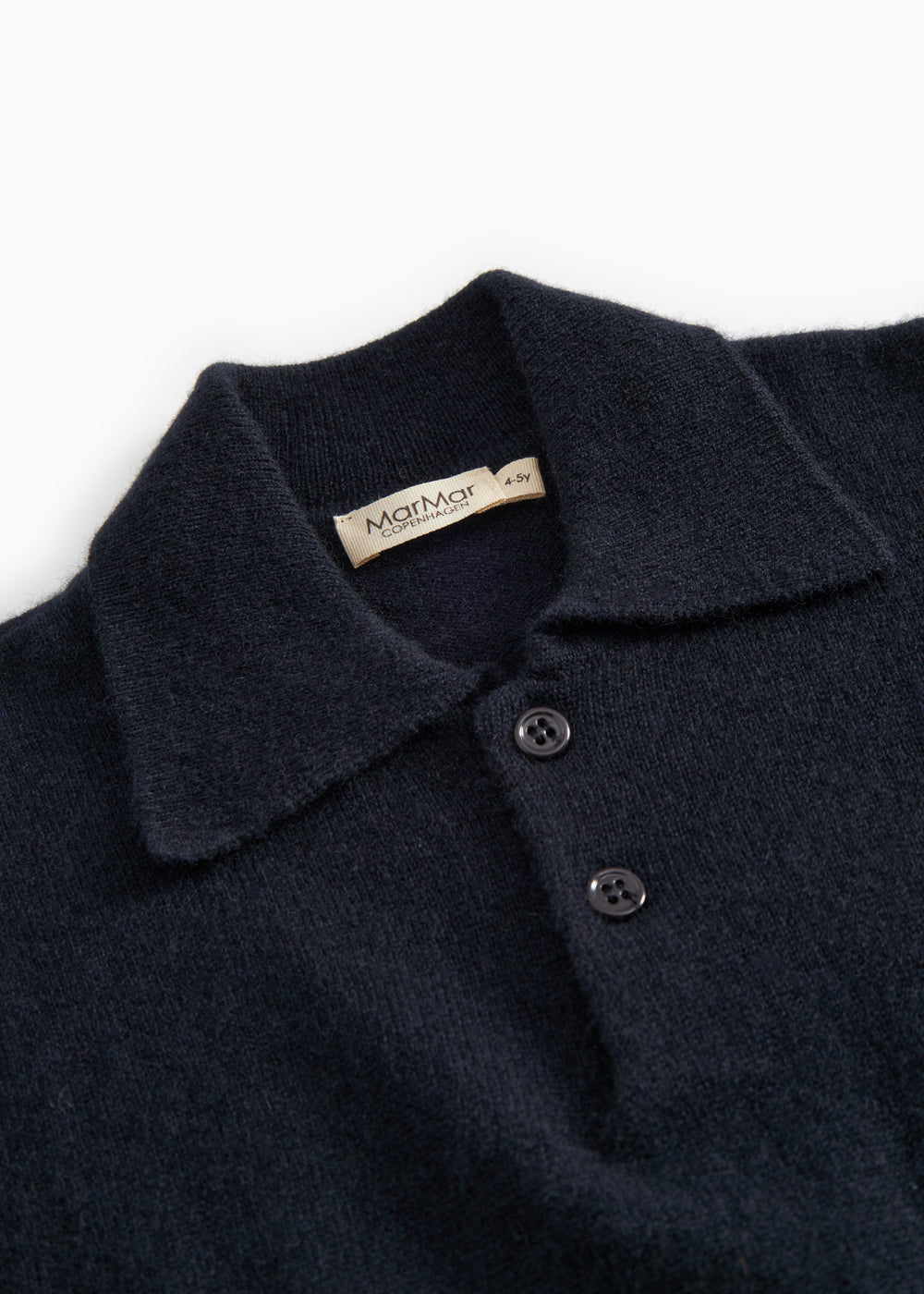Button and collar on dark indigo polo shirt with two buttons