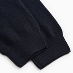 Indigo Kashmir trousers with elastic cuff and visible seam at the ankle.