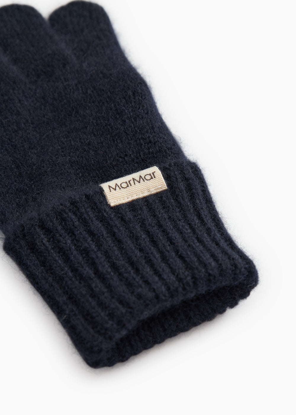 Long Kashmir scarf in dark indigo with ribbed cuff and sewn-in label.
