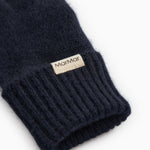 Long Kashmir scarf in dark indigo with ribbed cuff and sewn-in label.