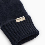 Long Kashmir scarf in dark indigo with ribbed cuff and sewn-in label.