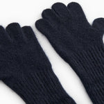 Long Kashmir handkerchief in dark indigo, close-up view of palms and ribbed cuff.