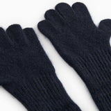 Long Kashmir handkerchief in dark indigo, close-up view of palms and ribbed cuff.
