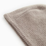 Gray knitted sweater with tight rib pattern and thick knit.