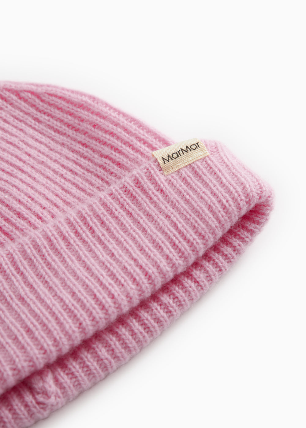 Details of pink Kashmir striped sweater hat with knit pattern and brand label.