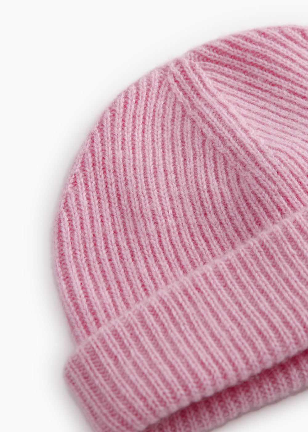 Close-up of pink Kashmir knit hat at the edge and rib knit.