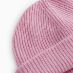 Close-up of pink Kashmir knit hat at the edge and rib knit.
