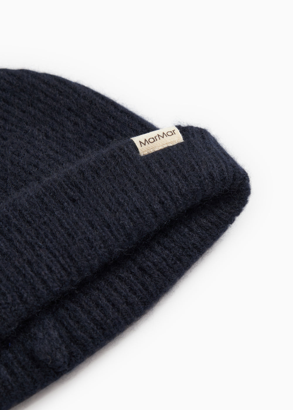 Atlas Kashmir hue in dark indigo with MarMar branding on the rib edge.