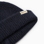 Atlas Kashmir hue in dark indigo with MarMar branding on the rib edge.