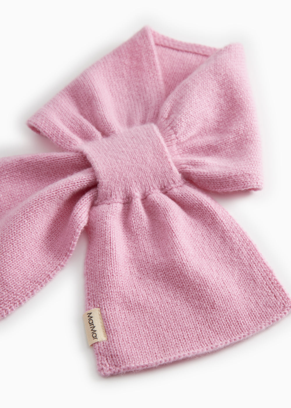 Pink knit scarf with bow knot and visible woven texture