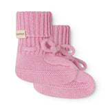 Pink knitted baby onesies with a bow tie and MarMar brand, side view.