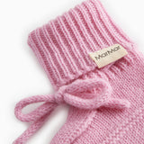 Pink knitted baby onesies with ribbed edge and MarMar brand, tied bow.