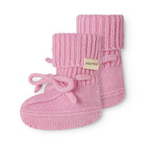 Pink knitted baby onesies with ribbed edges, a bow strap, and a MarMar label.