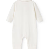 Off-white baby onesie with round neck and long sleeves, opening at the crotch.