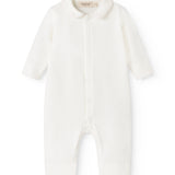 Off-white baby dress with collar and front button closure, long sleeves.