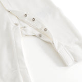 Ricci dress in light off-white with snap button closure and lace trim at the front.