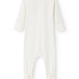 Cream-colored dress with long sleeves and footed legs, round neckline and back cut.
