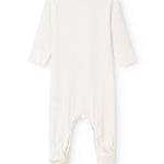 Baby romper in white fabric with a crotch opening and long pants legs.