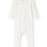 Baby ones in white fabric with button collar and zipper at the neck, plus long sleeves.