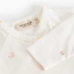 Bodystocking offwhite with colored print, collar and snap buttons at the shoulder.