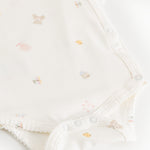 Bodystocking offwhite with a small pattern, creased edge and pressure buttons in steps.