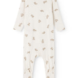 White dress with beige teddy bear print, long sleeves and round neck.