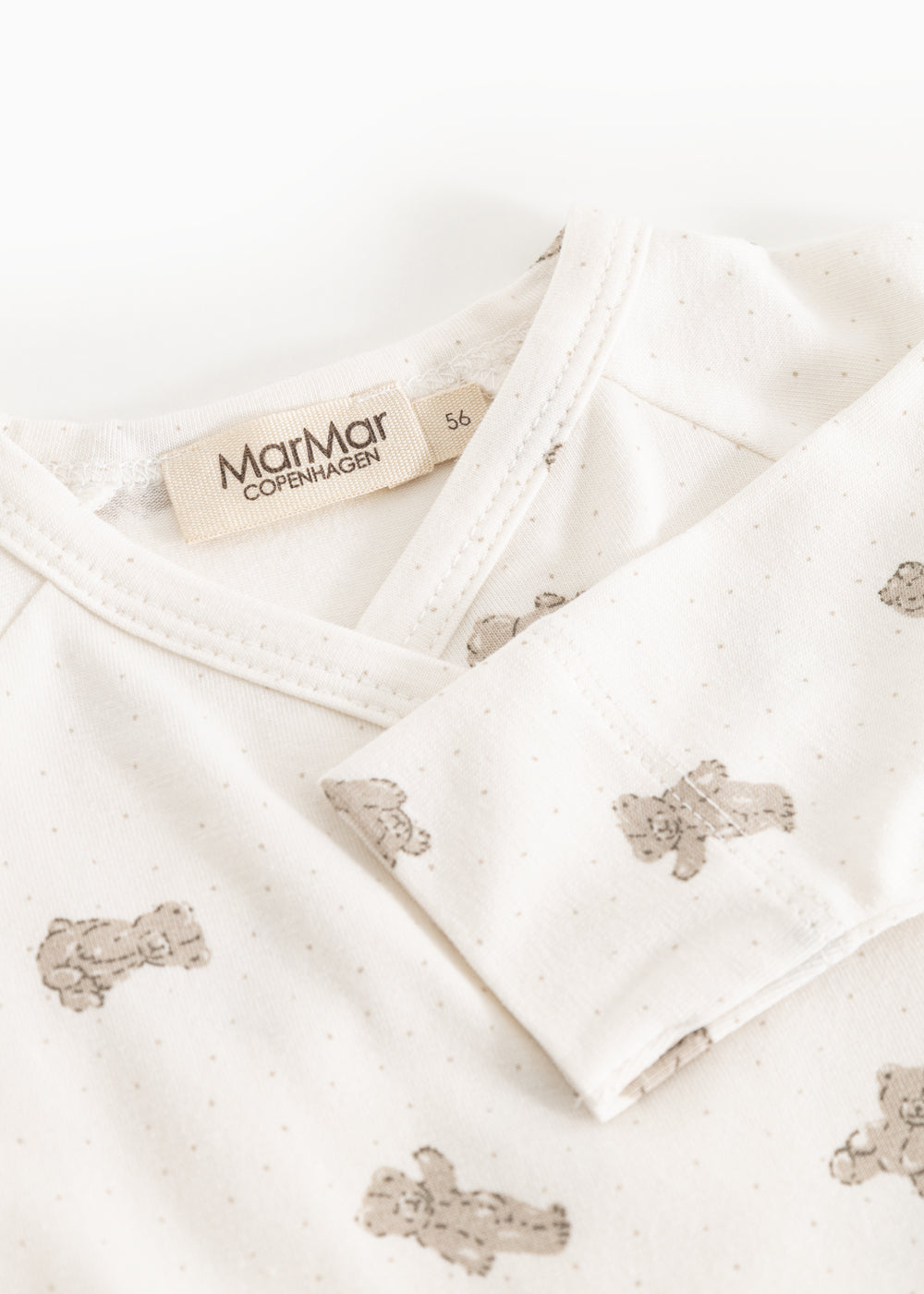 White dress with beige teddy bear print, collar and MarMar Copenhagen brand.