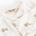 White dress with beige teddy bear print, collar and MarMar Copenhagen brand.